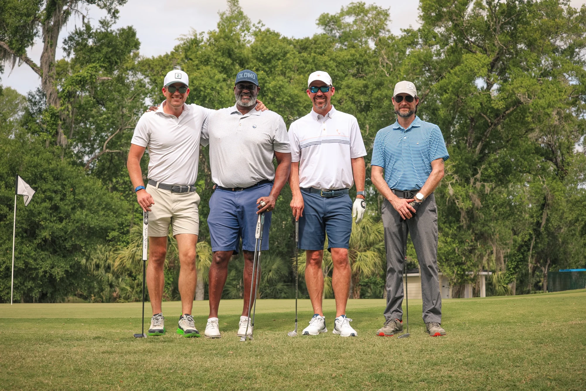 Golf tournament foursome on the course