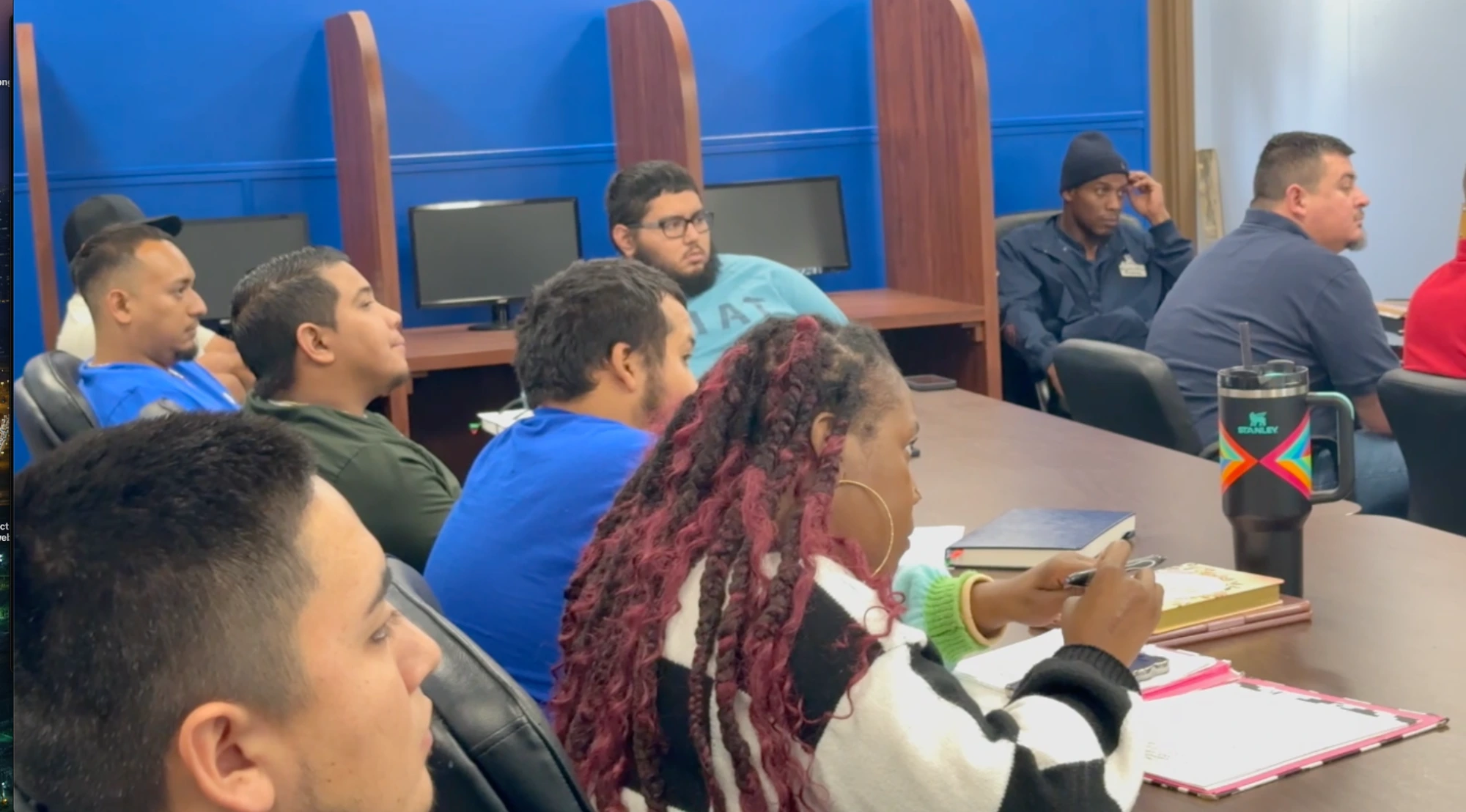 Superintendent School participants listening and taking notes